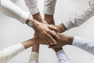 Team hands stacked on each other